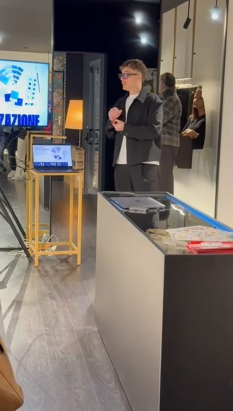 Andrea presenting his work at an event